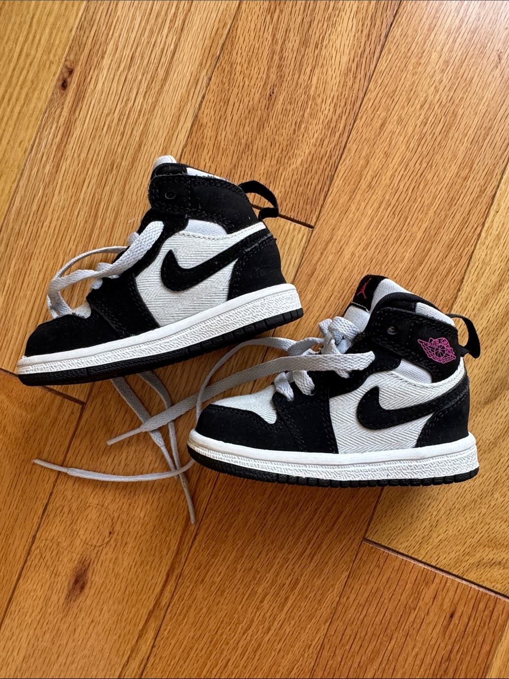 Nike Jordan’s Toddler Black and White High-Top Sneakers with Pink Logo Accent